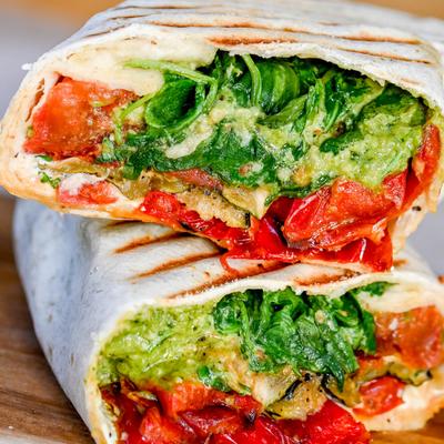 Wrap with roasted vegetables, goat cheese, arugula, and sunflower pesto.