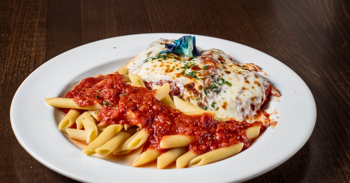 Chicken Parmesan with marinara sauce and penne pasta