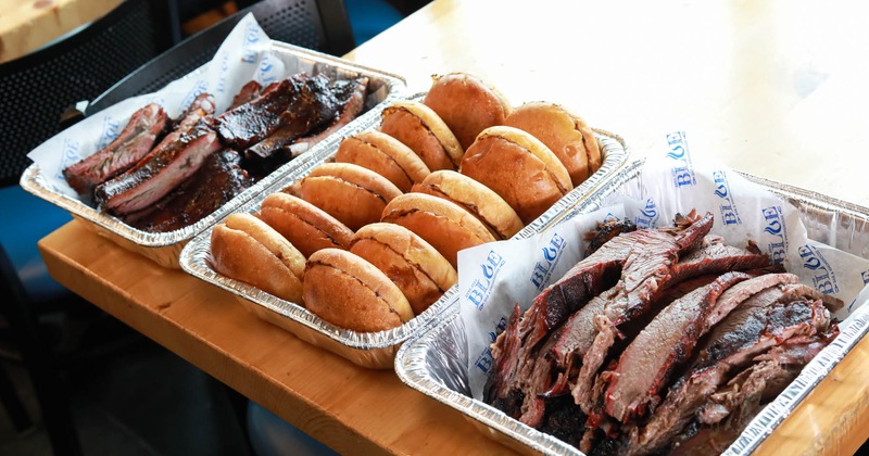 Multiple platters with various dishes