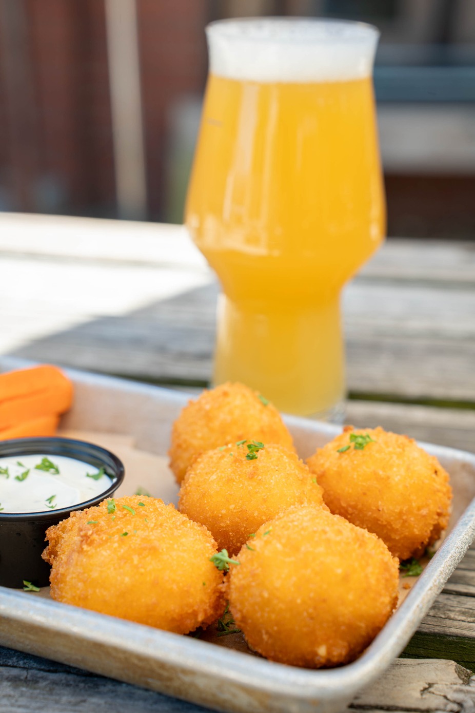 Pimento Cheese Jalapeño Poppers - Pimento cheese stuffed jalapeños, fried crispy with celery, carrot sticks, and ranch dressing.