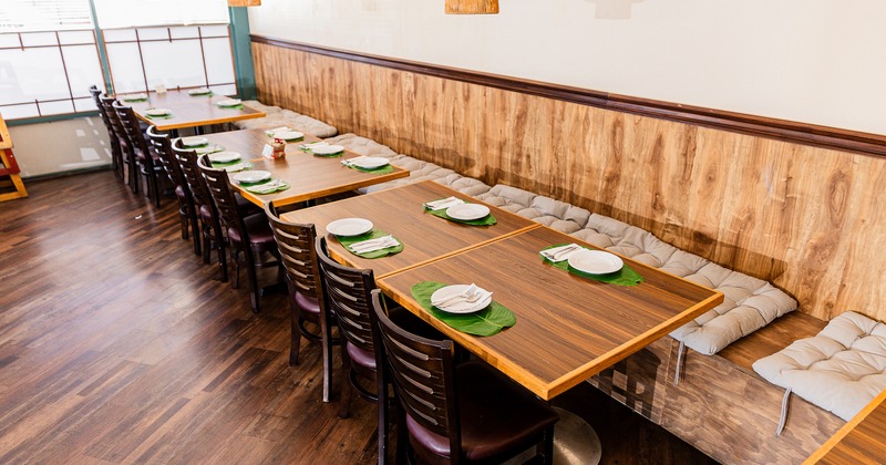 Cozy interior dining area with tables set for guests
