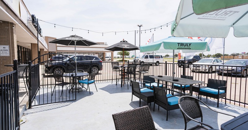 Exterior, tables with parasols and chairs