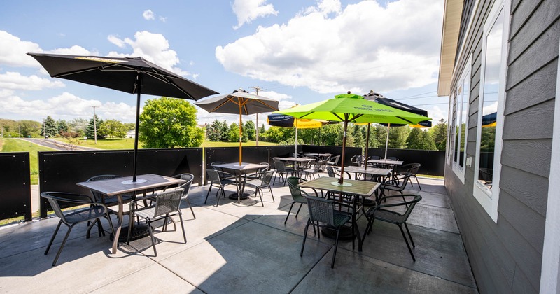 Exterior, patio, tables with parasols and chairs