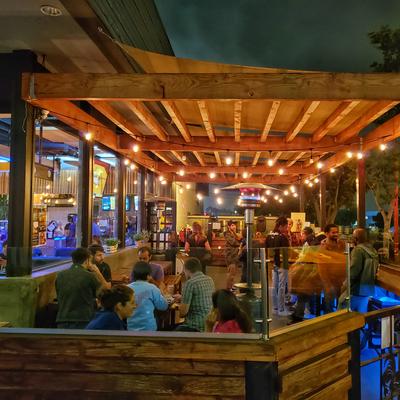 Covered patio area at our Convoy location, guests dining small