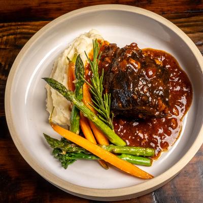 Braised Short Rib, with mashed potatoes, demi glace, roasted carrots and asparagus.