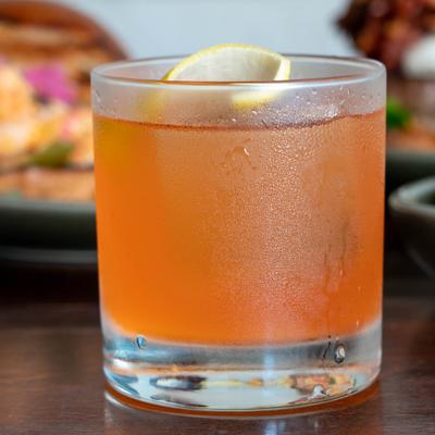 A cocktail served in a glass