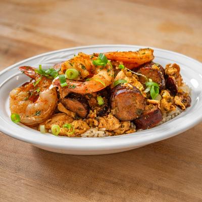 Shrimp and sausage served over seasoned rice.