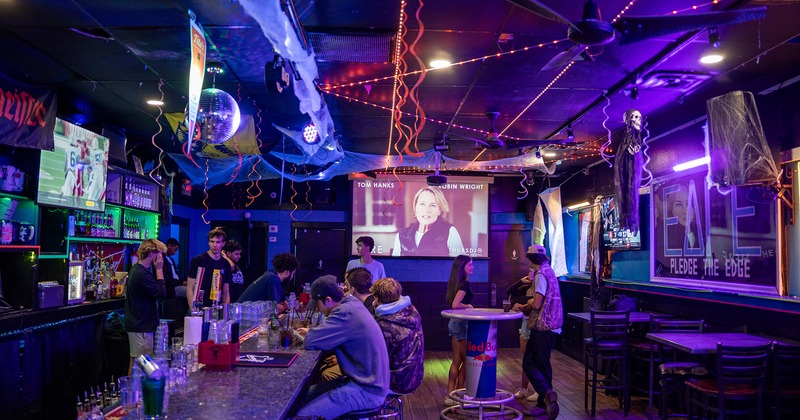 Interior space, seating area and bar with guests