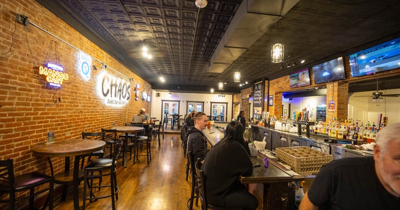 Interior, seating area with a bar on the right