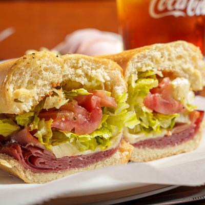 Italian Sub, with salami, ham, provolone, onion, tomato, lettuce, and dressing.