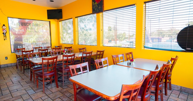 Restaurant interior, dining area, lined-up dining tables