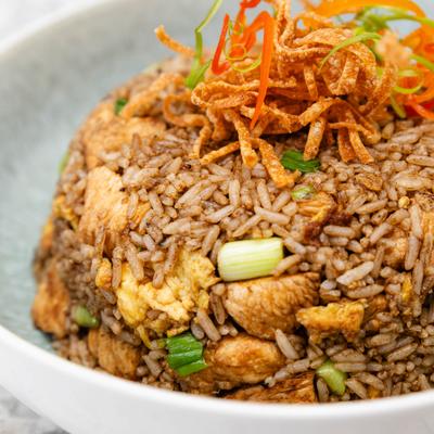 Peruvian chicken fried rice topped with crispy tortilla strips.
