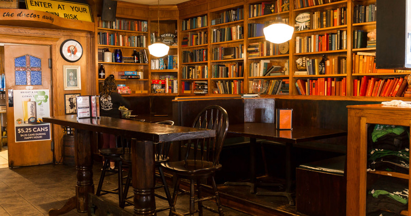Interior, tables, chairs and shelves with books