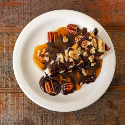 Top view at the plate with Turtle Cheesecake.