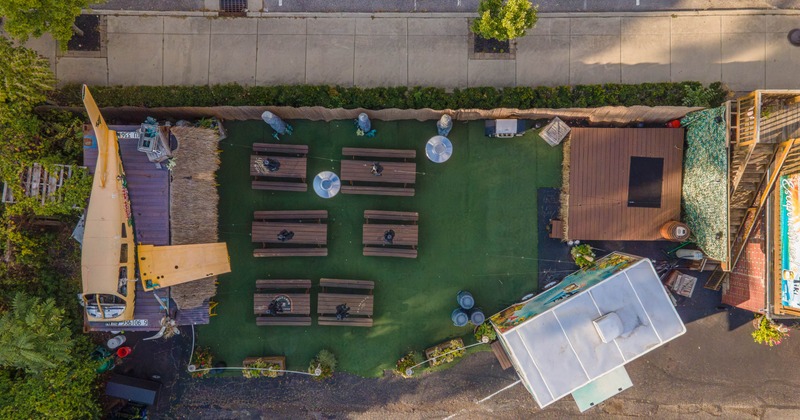 Aerial view of an outdoor seating area with picnic tables