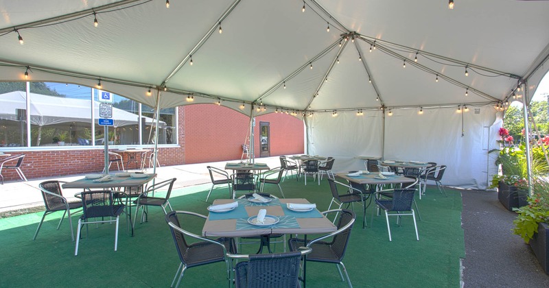Exterior, seating area under tent