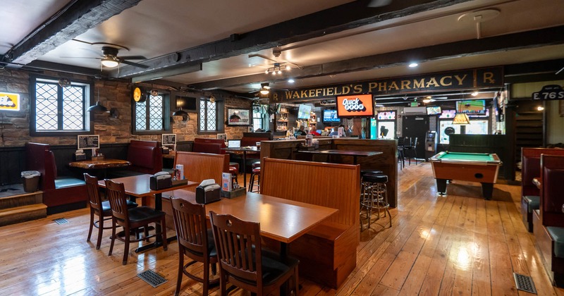 Interior of a cozy restaurant with wooden tables