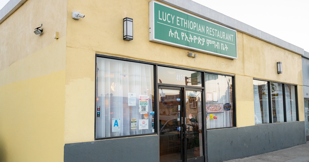 Restaurant front entrance and sign above the door