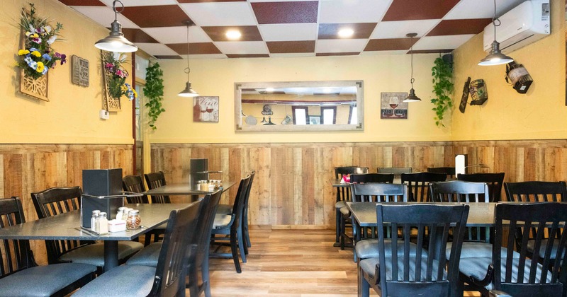 Interior, dining area, wooden flooring and wall coating, checkered ceiling tile pattern