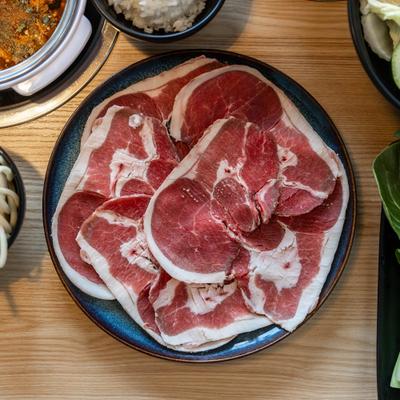 Thin slices of meat on a plate.