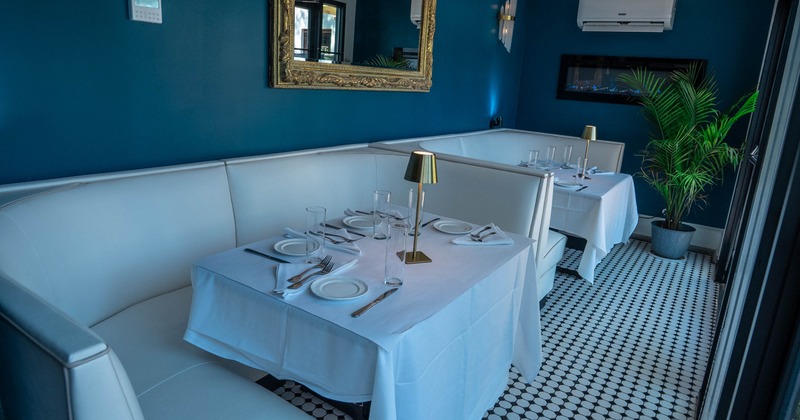 Interior, white leather sofas with tables
