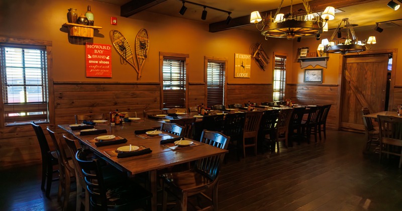 Interior, dining area with warm lightning , wooden chairs and tables