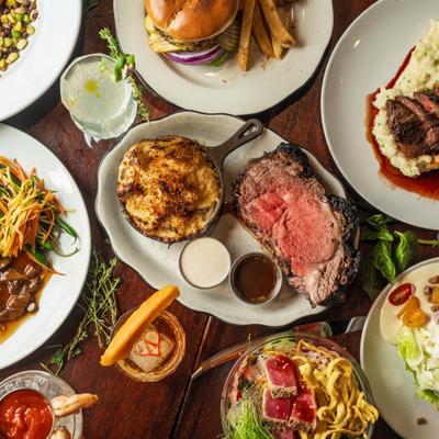 Assorted dishes and cocktails on a table.