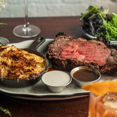 Roasted prime rib served with gratin potatoes, horseradish cream, and rosemary au jus.