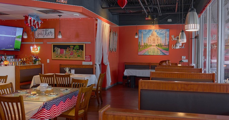 Interior, seating area with booths, tables and chairs