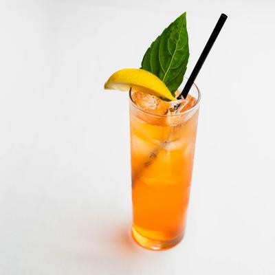 Arnold Palmer with lemon and a bay leaf garnish.