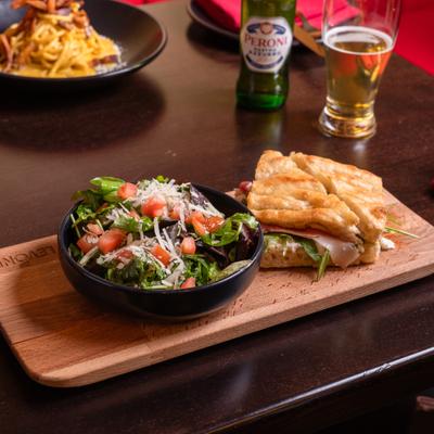 Prosciutto sandwich and salad.