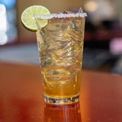 Ultimate Margarita in salt-rimmed glass and lime wheel garnish.