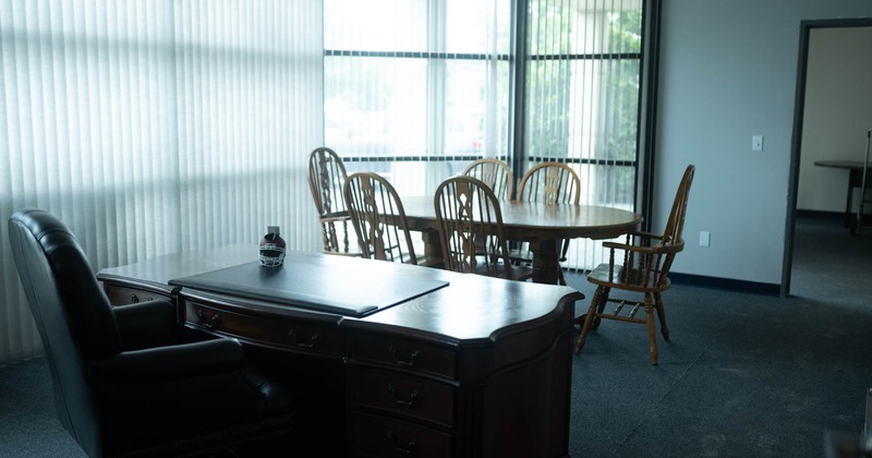 Interior, wooden table for six, vintage wooden desk with armchair, carpet flooring