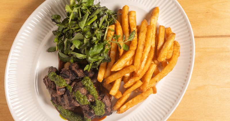 Steak with fries and greens