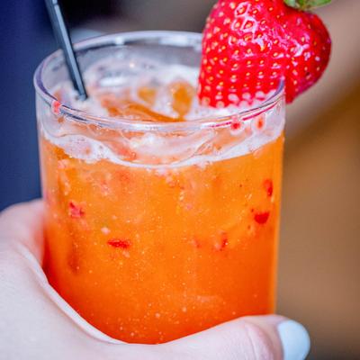 Strawberry mango bourbon smash cocktail.