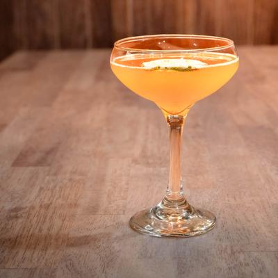 A cocktail served in a coupette glass.