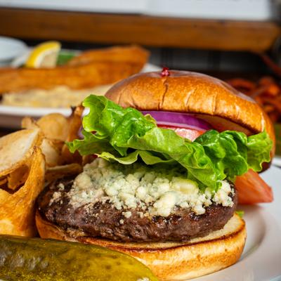 Black and Bleu Burger with potato chips.