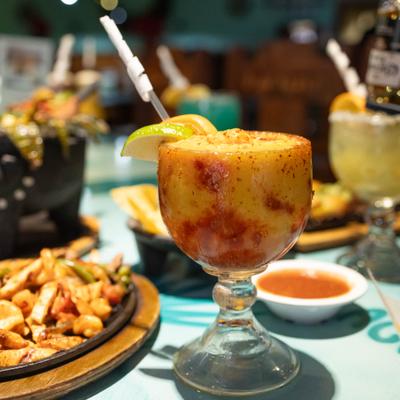 Various drinks served on the table alongside food