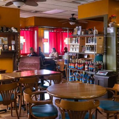 Diner room, tables, chairs, guests.