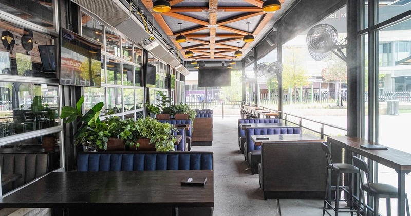 Booths and armchairs in patio area