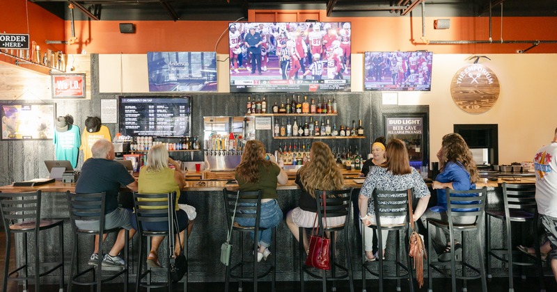 Bar, guests, tv above