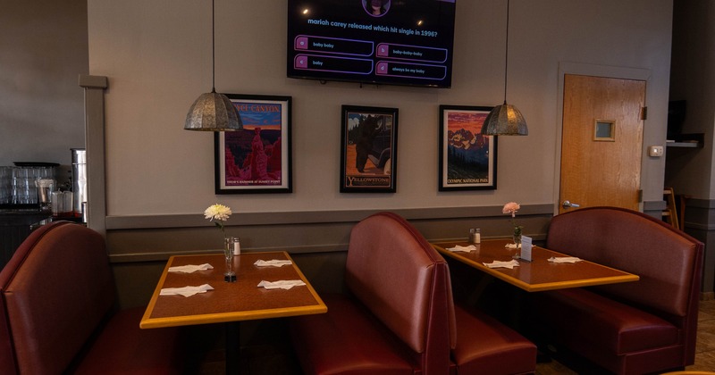 Upholstered dining booths ready for guests