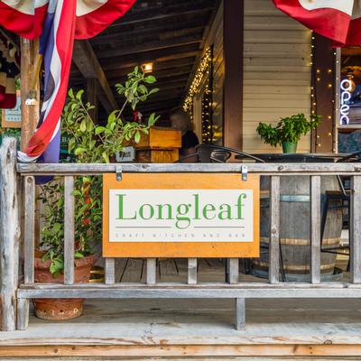 Exterior, restaurant sign on fence