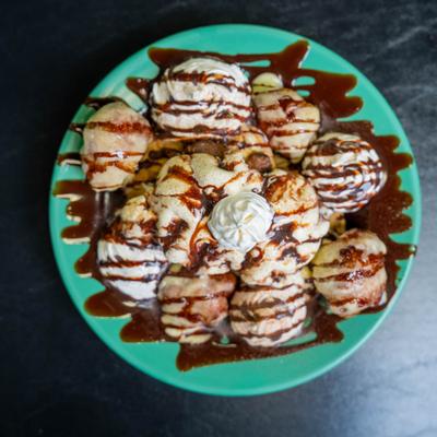 Cookie Sundae topped with cinnamon sugar, whipped cream and chocolate syrup.