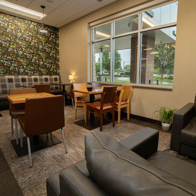 Interior, a modern room featuring  a mix of seating options and decor.