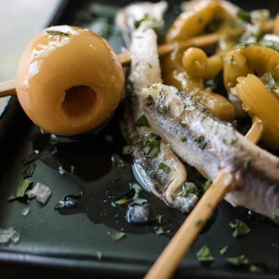 Olives and skewered snacks.