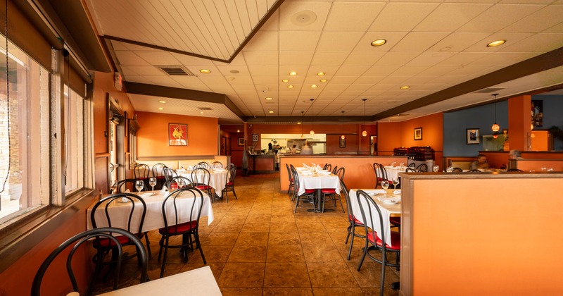 Interior, dining area, tables ready for guests