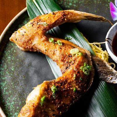 Grilled yellow tail collar, close up.