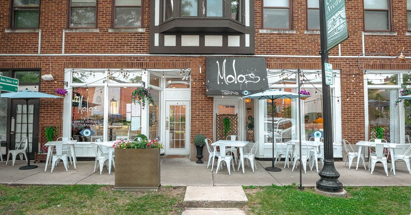 Exterior, tables and chairs near entrance