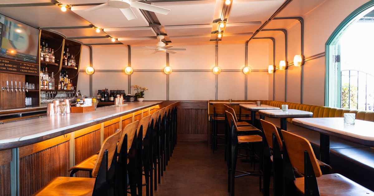 Interior with a well-stocked bar and high-top seating